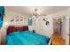Cozy bedroom with hardwood floors, stylish lighting and unique wall art at 3520 Arch St, Orlando, FL 32808