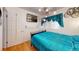Comfortable bedroom with hardwood floors, a window, and modern lighting at 3520 Arch St, Orlando, FL 32808