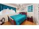 Serene bedroom featuring hardwood floors, stylish lighting, and calming decor at 3520 Arch St, Orlando, FL 32808