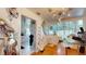 Open dining area with modern decor, adjoining a well-lit kitchen space at 3520 Arch St, Orlando, FL 32808