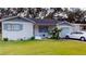 Quaint single-Gathering home featuring a lush green lawn and a one-car garage at 3520 Arch St, Orlando, FL 32808