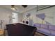 Spacious game room features a pool table, laundry area, and comfortable purple sofa at 3520 Arch St, Orlando, FL 32808