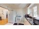 Well-lit kitchen with modern appliances, white cabinets, and granite countertops at 3520 Arch St, Orlando, FL 32808