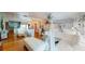 Bright living room with hardwood floors and a unique mirrored wall at 3520 Arch St, Orlando, FL 32808