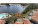 Aerial view of the backyard of a home that backs up to a lake at 390 Miro Dr, Davenport, FL 33837