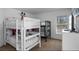 ' bedroom featuring bunk beds, a window with natural light, and a modern dresser at 390 Miro Dr, Davenport, FL 33837