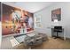 Bedroom with Star Wars themed mural, plush beanbag chairs, and a functional desk area at 390 Miro Dr, Davenport, FL 33837