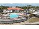 Exterior view of the community pool with lounge chairs and pergolas at 390 Miro Dr, Davenport, FL 33837