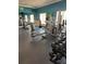 View of fitness center with gym equipment and mirror at 390 Miro Dr, Davenport, FL 33837