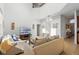 Living room with high ceilings, sofas, a television, and tile flooring at 390 Miro Dr, Davenport, FL 33837
