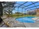 Outdoor screened pool with lounge chairs, perfect for relaxation and entertaining at 390 Miro Dr, Davenport, FL 33837