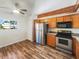 Modern kitchen with stainless steel appliances, wood cabinets, and lots of light at 4464 Middlebrook Rd # 4, Orlando, FL 32811