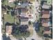 Aerial view of home showcasing a backyard pool, solar panels, and well-manicured lawn at 477 Bohannon Blvd, Orlando, FL 32824