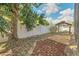 Backyard with landscaping and a gazebo at 477 Bohannon Blvd, Orlando, FL 32824