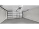 Spacious garage features sealed concrete floor and functional door at 477 Bohannon Blvd, Orlando, FL 32824