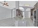 Kitchen area features tile floor, stone backsplash, stainless steel appliances, and granite countertops at 477 Bohannon Blvd, Orlando, FL 32824