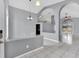 Spacious living room with modern gray walls, high ceilings, and sliding glass doors to the pool area at 477 Bohannon Blvd, Orlando, FL 32824