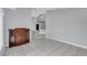 Open-concept space with tile floors, gray walls, and an antique cabinet at 477 Bohannon Blvd, Orlando, FL 32824