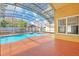 The enclosed pool area provides an inground pool, screened-in patio, and a charming backyard gazebo at 477 Bohannon Blvd, Orlando, FL 32824