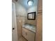 Bathroom featuring tiled walls, granite vanity, new fixtures, and modern lighting at 48 E Par St, Orlando, FL 32804