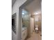 Bathroom featuring updated vanity, granite countertop and tiled walls at 48 E Par St, Orlando, FL 32804