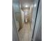 Bathroom featuring tiled floors and walls, granite vanity, toilet, and shower behind a curtain at 48 E Par St, Orlando, FL 32804