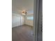 Bedroom features laminate flooring, a closet with white doors, and a window for natural light at 48 E Par St, Orlando, FL 32804