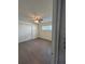 Cozy bedroom featuring hardwood floors, closet and a ceiling fan at 48 E Par St, Orlando, FL 32804