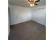 Spacious bedroom featuring hardwood floors, closet and a ceiling fan at 48 E Par St, Orlando, FL 32804