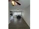 Dining area featuring a dark wood table, ceiling fan, wood-look flooring and natural light at 48 E Par St, Orlando, FL 32804