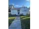 Charming single-story home with a well-maintained front yard and inviting walkway at 48 E Par St, Orlando, FL 32804