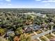 An aerial shot showcasing the home's location, mature trees, nearby street, and neighborhood at 4804 Beacon St, Orlando, FL 32808