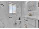 Bathroom featuring a toilet, sink, vanity, mirror and tiled walls at 4804 Beacon St, Orlando, FL 32808