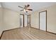 Bedroom with light wood floors, ceiling fan, bathroom, closet and neutral colored walls at 4804 Beacon St, Orlando, FL 32808