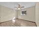 Bedroom with light wood flooring, ceiling fan, window and neutral colored walls at 4804 Beacon St, Orlando, FL 32808