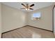 Bedroom with light wood flooring, ceiling fan, window and neutral colored walls at 4804 Beacon St, Orlando, FL 32808