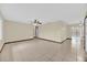 Spacious living room with tile floors, a ceiling fan, and natural light streaming in from the adjacent pool area at 4804 Beacon St, Orlando, FL 32808