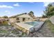 Backyard view of a private in-ground pool and patio area, perfect for outdoor entertaining at 4804 Beacon St, Orlando, FL 32808