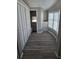 Bright bedroom features wood-look flooring, ample closet space, and natural light from the bay window at 50989 Highway 27 # 105, Davenport, FL 33897