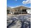 An exterior view of this home shows a covered carport and screened porch at 50989 Highway 27 # 105, Davenport, FL 33897