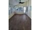 Bright sunroom with wood-look flooring and multiple windows that offer lots of natural light at 50989 Highway 27 # 105, Davenport, FL 33897