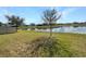 Backyard with a serene lake view, ideal for relaxation and nature enjoyment at 5323 Rochester Pl, St Cloud, FL 34771