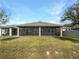 Expansive backyard with a covered patio, perfect for outdoor entertaining and relaxation at 5323 Rochester Pl, St Cloud, FL 34771