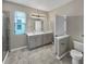 Bathroom featuring double sink vanity and tiled floors at 5323 Rochester Pl, St Cloud, FL 34771