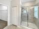 Beautiful bathroom featuring a tiled shower with glass door at 5323 Rochester Pl, St Cloud, FL 34771