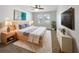 Stylishly decorated bedroom with soft rug, modern furniture, and natural lighting at 5323 Rochester Pl, St Cloud, FL 34771