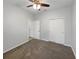 Spacious bedroom with carpet flooring, a ceiling fan, and a closet at 5323 Rochester Pl, St Cloud, FL 34771