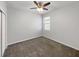 Bedroom featuring carpet flooring, a ceiling fan, and a window at 5323 Rochester Pl, St Cloud, FL 34771