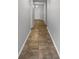 Inviting hallway with neutral paint, white trim, and a decorative tile flooring at 5323 Rochester Pl, St Cloud, FL 34771