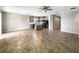 Open layout kitchen with stainless steel appliances, island, and pendant lighting at 5323 Rochester Pl, St Cloud, FL 34771